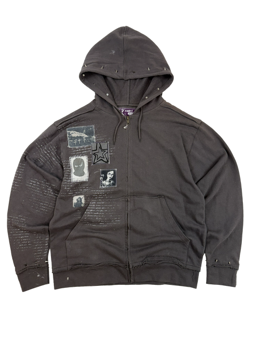 Dark gray jacket with patches on a white background